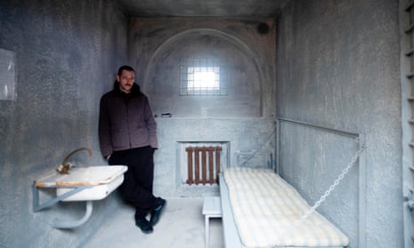 Alexei Navalny's brother Oleg Navalny poses inside a replica of Alexei's Russian prison. It highlights the situation and ongoing imprisonment.