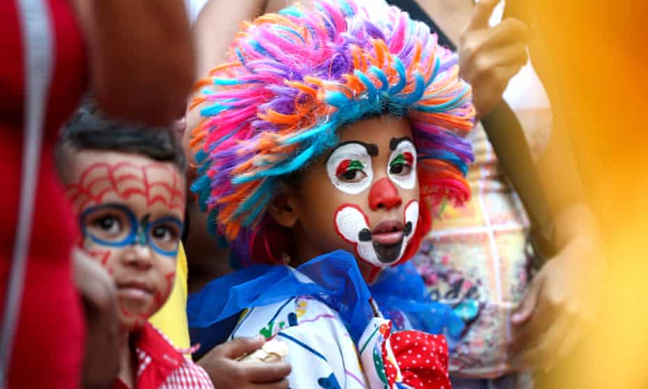 Children in makeup at a carnival in Caracas, Venezuela