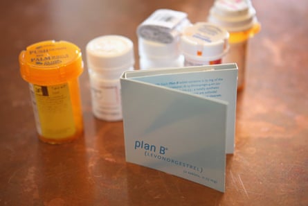 An image showing a slew of orange medicine containers and a Plan B pill packet