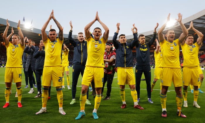 Ukraine players celebrate their win and applaud their fans after the final whistle.
