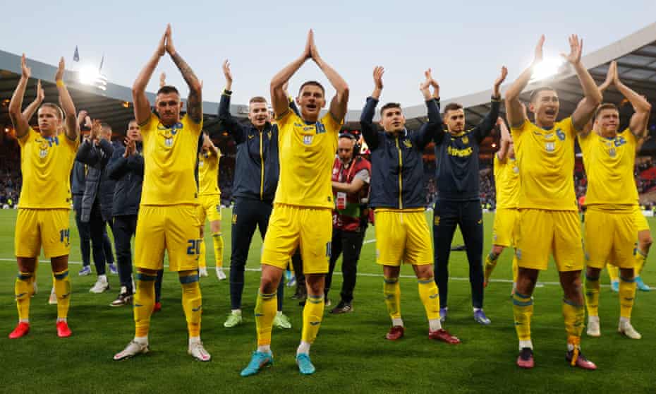Ukraine's players celebrate in front of their fans after overcoming Scotland