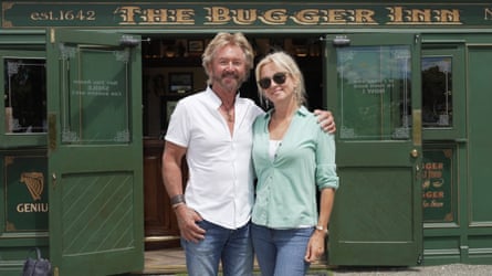 Edmonds and wife Liz in front of The Bugger Inn pub.