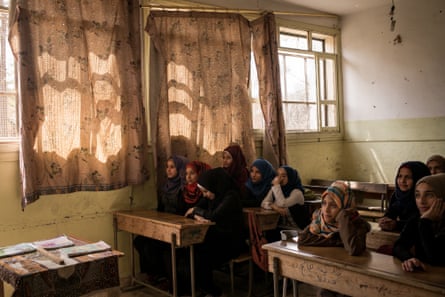 Raqqa: In the Aftermath of ISISStudents are seen in class at the heavily damaged Hawari Bu Medyan School, in Raqqa, Syria. May 2018. The school is located opposite a building that was used by ISIS’s religious police, the Hisba, and was also the site of intense fighting during the offensive to retake the city from the extremist group. The school reopened in January 2018.