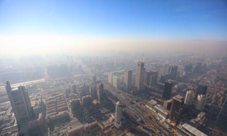 A photo taken from the China Zun, a skyscraper under construction in Beijing, shows the city being shrouded in heavy smog on Friday.