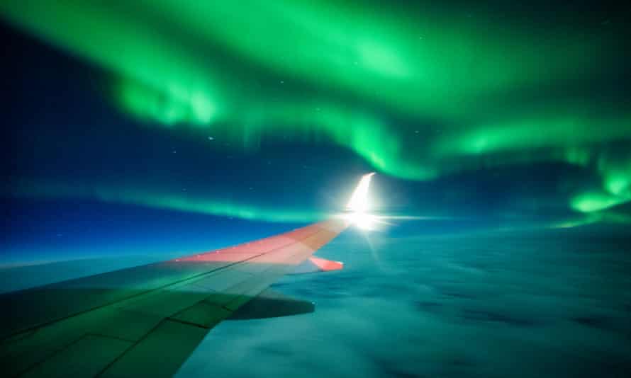 Aurora on PlaneNorthern Lights as observed on a plane with a wing