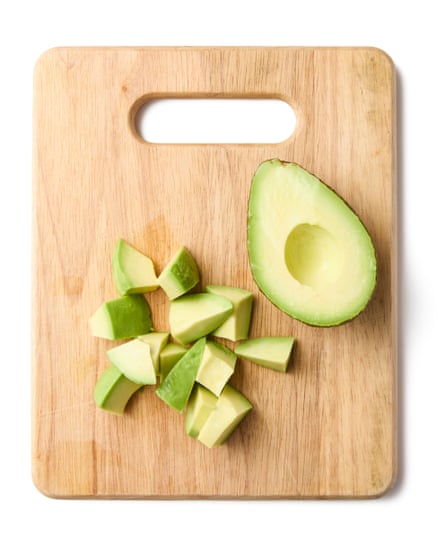 Felicity Cloake’s cobb salad, diced avocado on a wooden chopping board