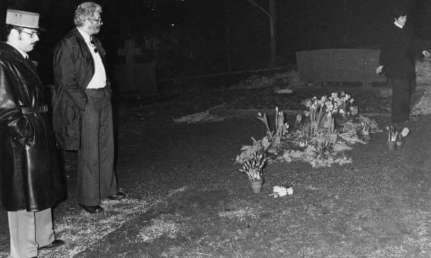Police at the desecrated grave of English film actor and director Charlie Chaplin in the cemetery at Corsier-sur-Vevey, Switzerland, March 1978.