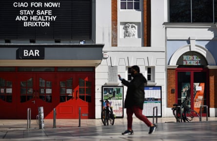 A pedestrian walks past the closed Ritzy Picturehouse in Windrush Square in Brixton, south London.