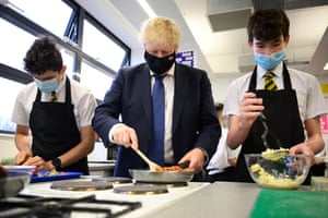 Boris Johnson joining pupils taking part in a cookery class at Oakwood School in his Uxbridge and South Ruislip constituency earlier today.