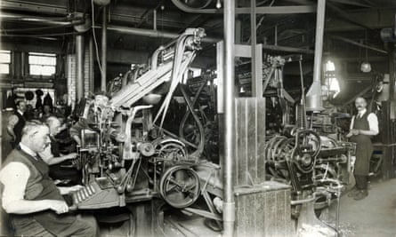 Typesetters working on Linotype machines in the composing room of the newspaper’s offices in Cross Street, Manchester, May 1921
