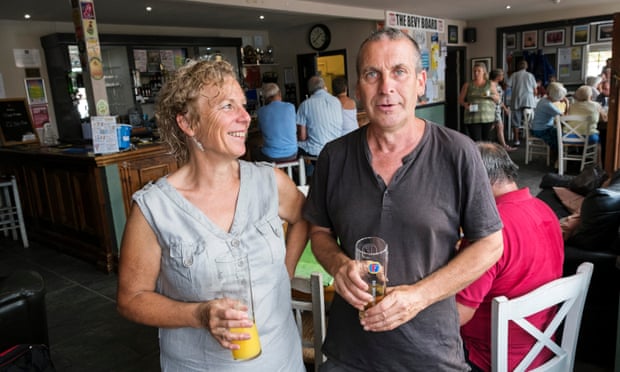 Helen Jones and Warren Carter, Bevy stalwarts, in the pub with bar and regulars behind