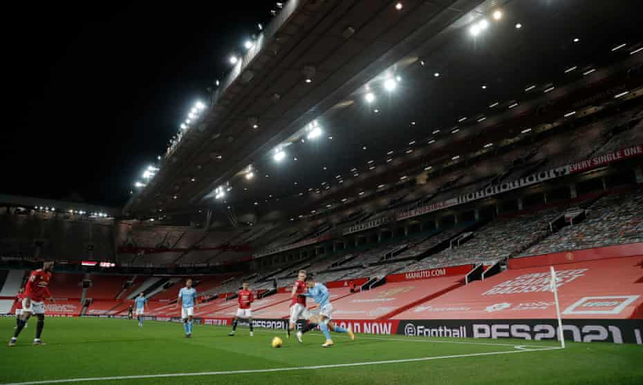 Manchester United entertain Manchester City at an empty Old Trafford in December. Most clubs have gone the entire season without any fans in their grounds.