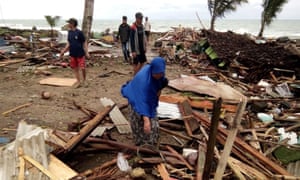 Residents inspect the damage to their homes on Carita beach in South Sumatra, Indonesia, after the area was hit by a tsunami that may have been caused by the Anak Krakatoa volcano. 
