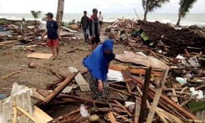 Residents inspect the damage to their homes on Carita beach in South Sumatra, Indonesia, after the area was hit by a tsunami that may have been caused by the Anak Krakatoa volcano.