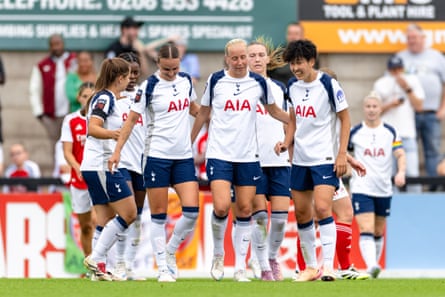 Players of Tottenham Hotspur celebrate a goal during the pre-season friendly game against Arsenal.