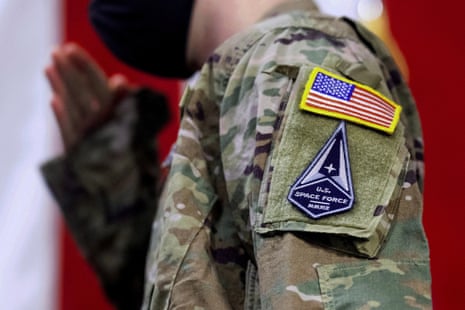Close up of the shoulder of someone wearing military fatigues. On the sleeve are patches of the American flag and the US Space Force.