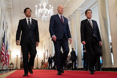 Filipino president Ferdinand Marcos Jr, US president Joe Biden and Japanese prime minister Fumio Kishida walk while meeting in Washington this week