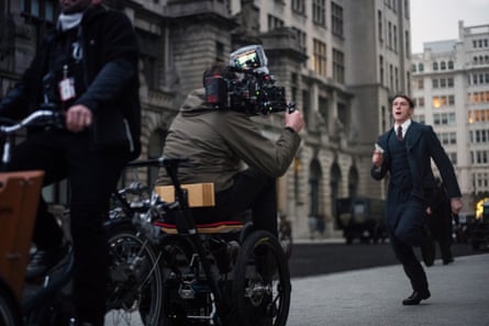 George MacKay running down ‘Whitehall’ - actually, the Liver Building in Liverpool. The camera is ahead of him on a makeshift tricycle