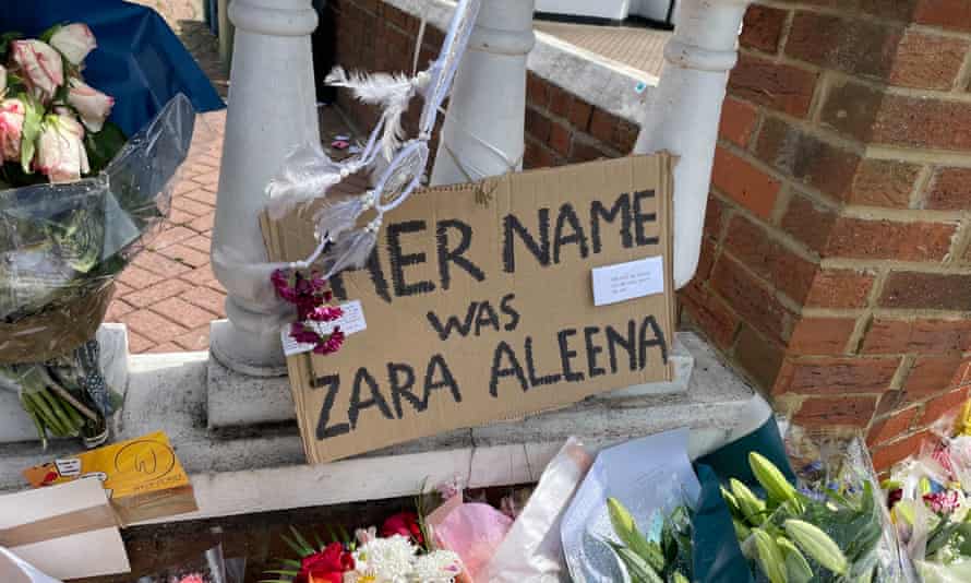sign says 'her name was Zara Aleena', among flowers