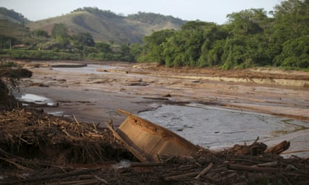 A boat is pictured in Rio Doce after a dam, owned by Vale SA and BHP Billiton Ltd burst, in Santa Cruz do Escalvado.