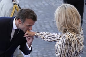 Paris, France. President Macron kisses his wife Brigitte’s hand during the Bastille Day parade
