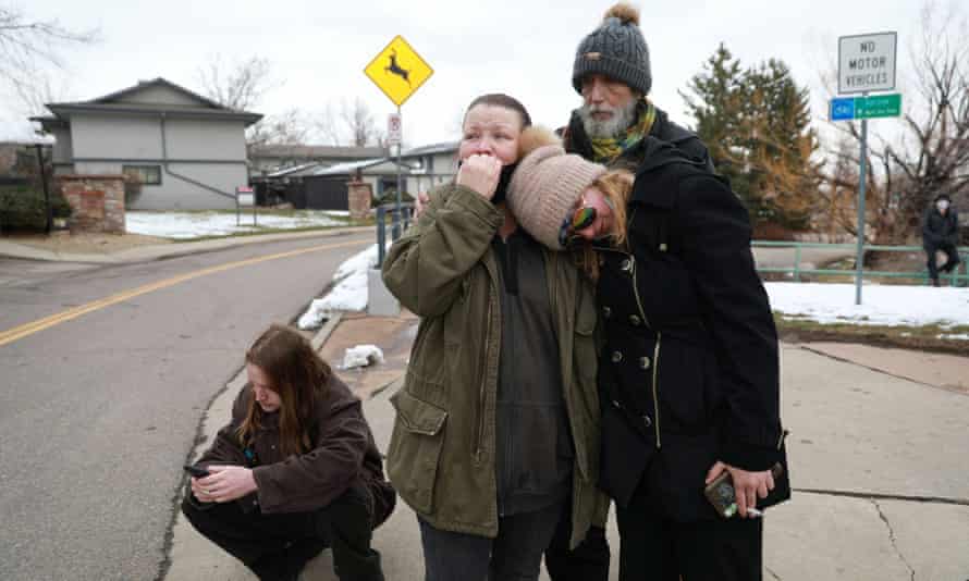 Sarah Moonshadow is comforted by David and Maggie Talley after Moonshadow was inside King Soopers grocery store during a shooting.