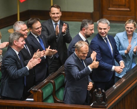 Poland's prime minister, Donald Tusk reacts after winning a vote of confidence at the Polish parliament in Warsaw, Poland.