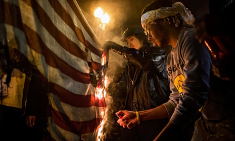 Burn, baby, burn … protesters set fire to a US flag in Washington, 2014. 