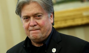 Steve Bannon attends as Trump signs executive orders in the Oval Office on Saturday.