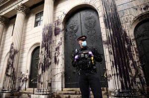 A police officer stands outside the Bank of England building