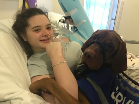 Amy Pohl in hospital with her dog, Bessler.