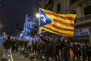 A protester waves a pro-Catalan independence flag in Barcelona