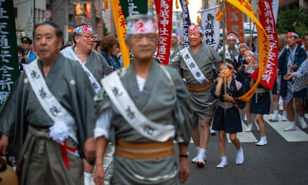 People march in Tokyo as part of the Torikoe-jinja shrine’s annual June festival.