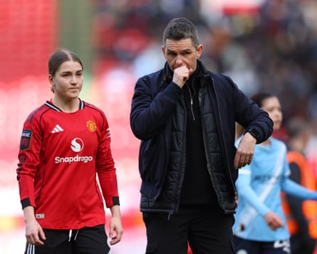 Jess Park and Marc Skinner look dejected at half-time during the Women’s Super League match between Manchester United and Manchester City at Old Trafford