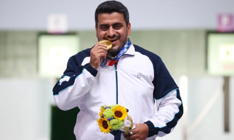 Iran’s Javad Foroughi with his gold in the 10-metre air pistol event