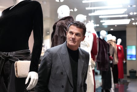 Peter Ruis leans forward from a line of mannequins at a John Lewis store at the Bluewater shopping centre.