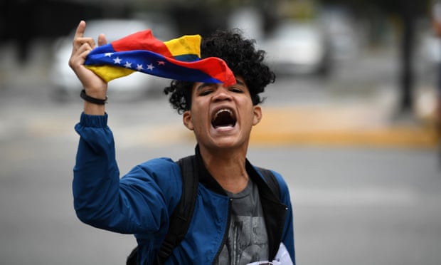 An opponent of Nicolás Maduro demonstrates in Caracas, Venezuela, on 4 May. 