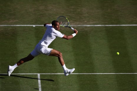 Felix Auger-Aliassime moves for a backhand.
