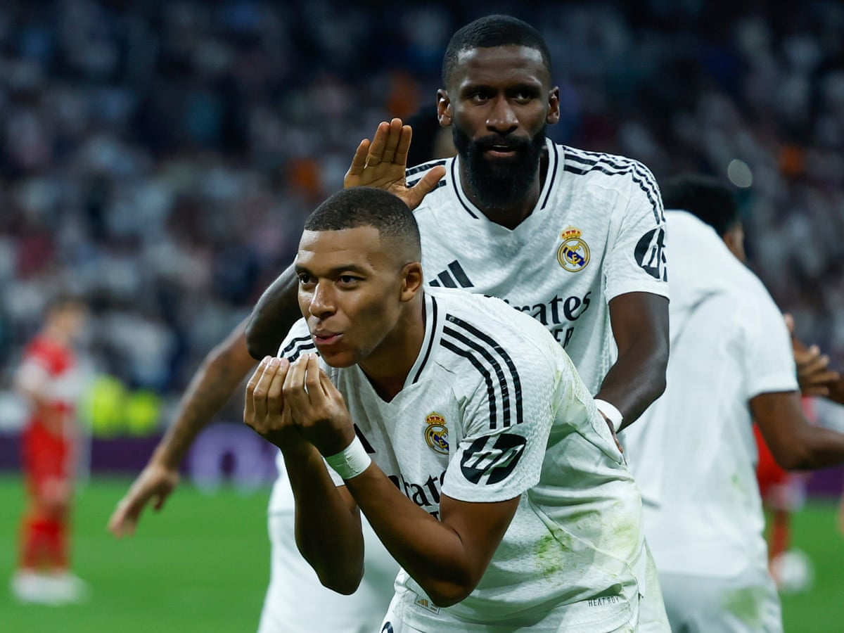 Mbappé and Rüdiger on target as Real Madrid scrap to late win over Stuttgart | Champions League | The Guardian