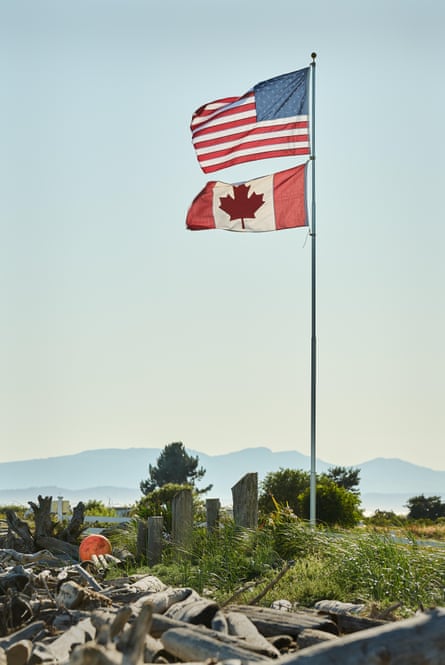 The US and Canadian flags fly in Point Roberts.