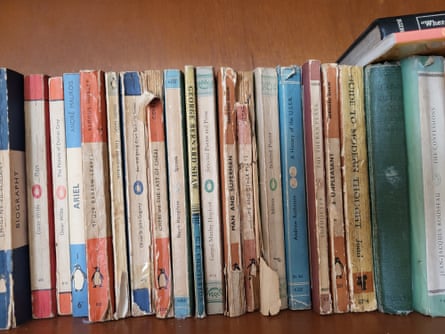 A tin of buttons (top) and a bookshelf at Enright’s parents’ house.