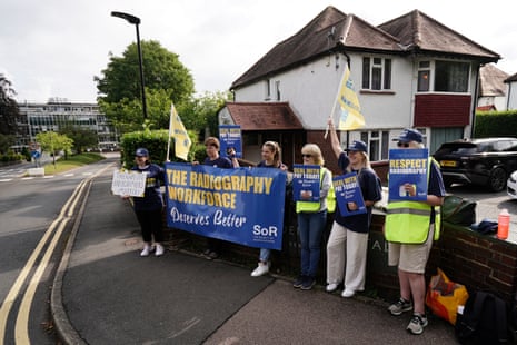 Members of the Society of Radiographers who are on strike at 37 NHS trusts in England today, on the picket line outside the Royal Marsden hospital in Sutton, south London, this morning.