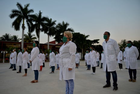 In this file photo taken on 28 March, 2020 doctors and nurses of Cuba’s Henry Reeve International Medical Brigade take part in a farewell ceremony before travelling to Andorra to help in the fight against the coronavirus pandemic, at the Central Unit of Medical Cooperation in Havana.