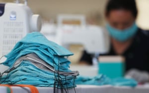 A shoe company in Culver City, California, makes masks to be donated to hospitals.