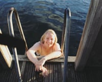 Laura Hall in the water by the steps in a sea pool smiling at the camera.
