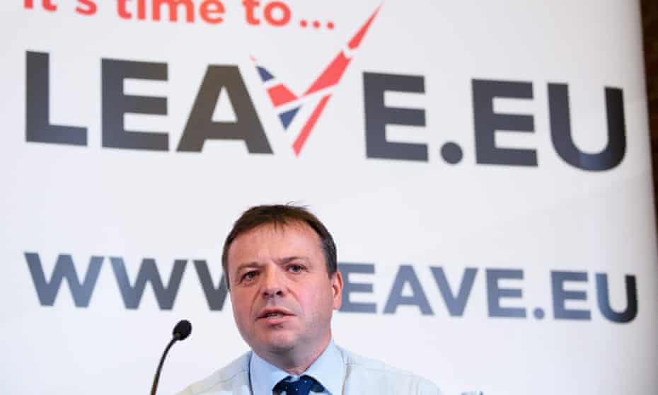 Arron Banks in front of a Leave.EU sign