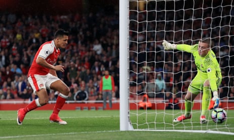 Arsenal’s Alexis Sanchez scores his side’s first goal of the game.