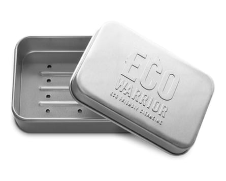 A metal soap tin embossed with Eco Warrior branding in the lid.