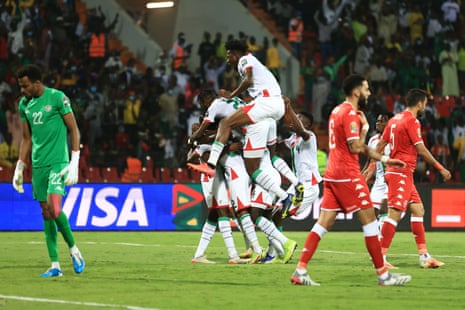 Burkina Faso’s players celebrate their team’s first goal.