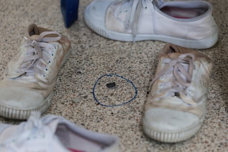 The remains of a bullet lies on the floor in the building where the shooting occurred at the Debsirin Nonthaburi School.